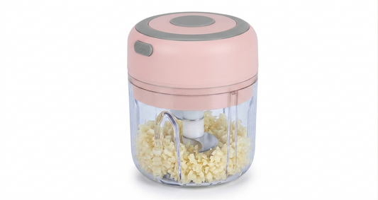 Close-up of stainless steel blades inside mini electric garlic chopper for efficient ingredient cutting
